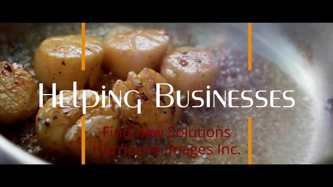 Scallops simmering in a pan with spices